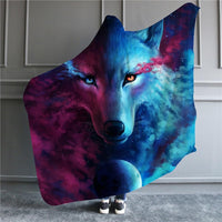 Wolf hooded blanket with split magenta-and-blue eyes and nose, worn