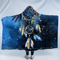 Front view hooded blanket in blue with dreamcatcher, feathers, and starry speckles