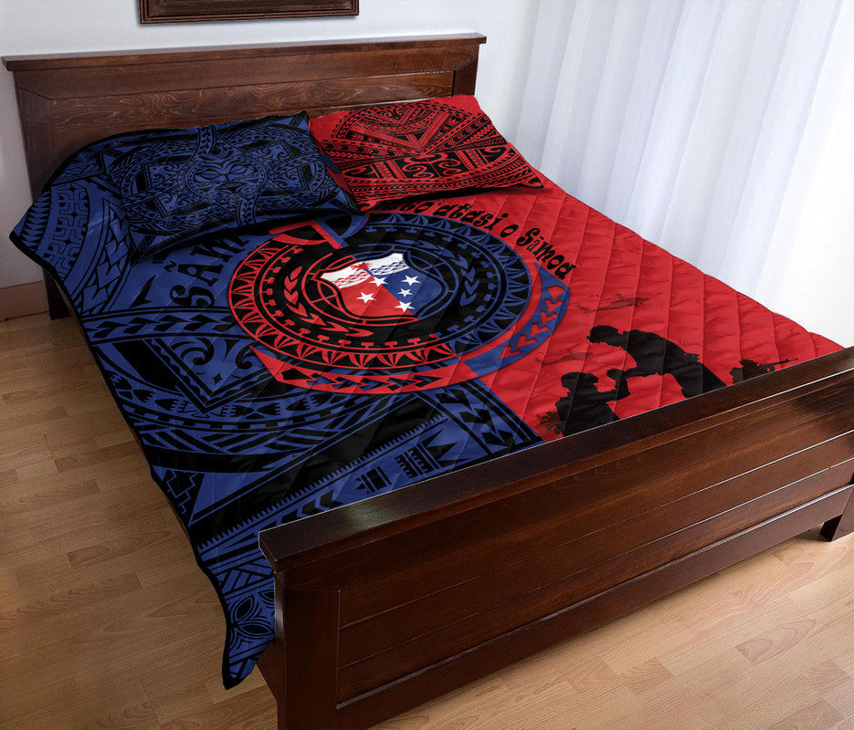 Red and blue quilt bed set with circular emblem, tribal pattern, and visible quilt edge