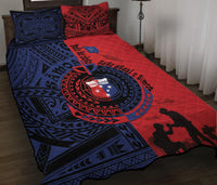 Red & blue quilt bed set with circular emblem, tribal pattern, and dark silhouettes