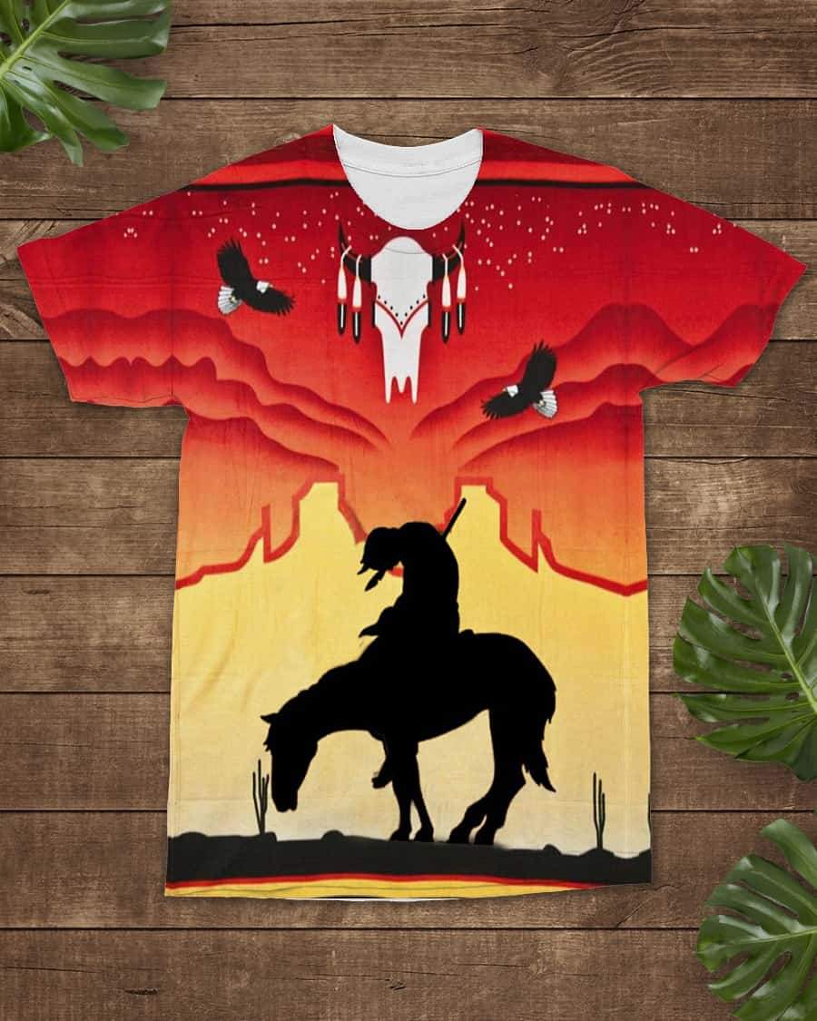 Red crewneck T-shirt with Native-style all-over graphic: horse rider in desert sunset