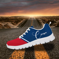 Custom sneakers with blue upper, red toe, white laces, white sole, and white cursive side text