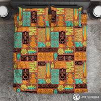 Multicolor tiki pattern bedding set on bed with pillows, pineapple and tiki icons