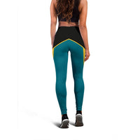 Back view active leggings: teal legs with black yoke and yellow triangle trim at hips