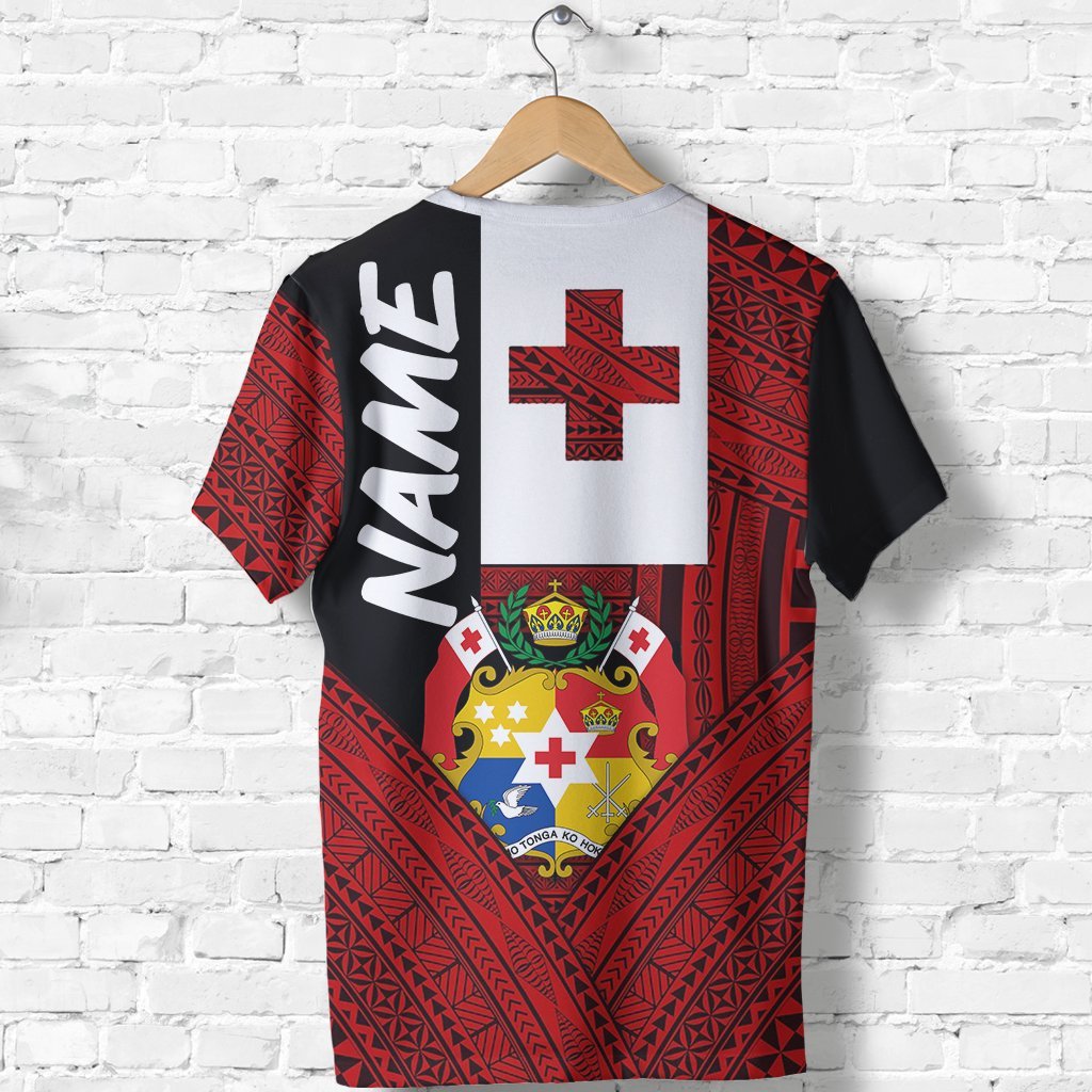 Front view T-shirt: red patterned body, black sleeves, white cross and crest emblem