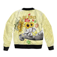 Yellow bomber jacket with black rib trim; back 'BE KIND' elephant with sunflowers.