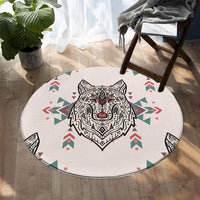 White round wolf carpet with geometric patterned wolf head and colorful tribal shapes