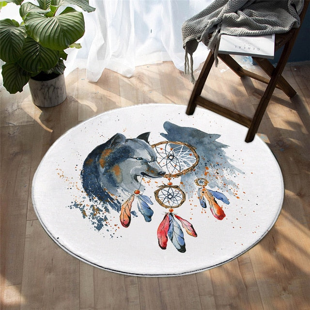 Round wolf rug with gray wolf head and red, blue dreamcatcher-style details