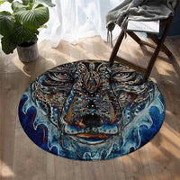 Round ornate wolf face rug with teal, blue, and gold decorative swirling pattern