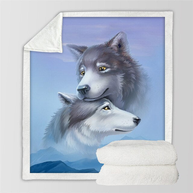 Sherpa blanket showing two light-gray wolves looking up; white plush sherpa backing.