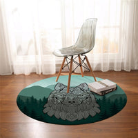 Round wolf carpet with teal background and gray wolf head above a forest border