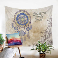 Cream dreamcatcher tapestry with blue circular web and text “Dreams came true”