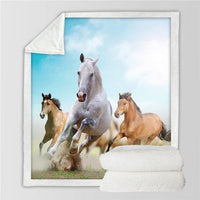 Horses printed throw blanket featuring white, tan, and chestnut horses running