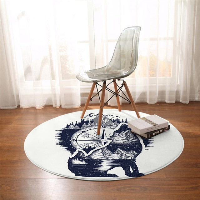 Native wolf round rug with blue illustrated wolf and starburst graphic, white border
