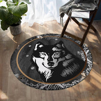 Round black wolf rug with two wolf faces and tan-gold swirl border designs