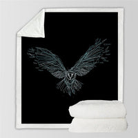 Soft throw blanket with thin-line geometric eagle design in mint-green on black