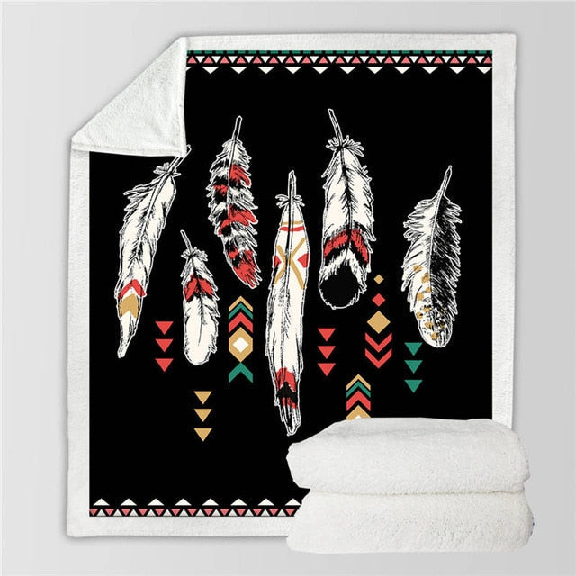Black feather print blanket with colorful geometric accents and white sherpa reverse