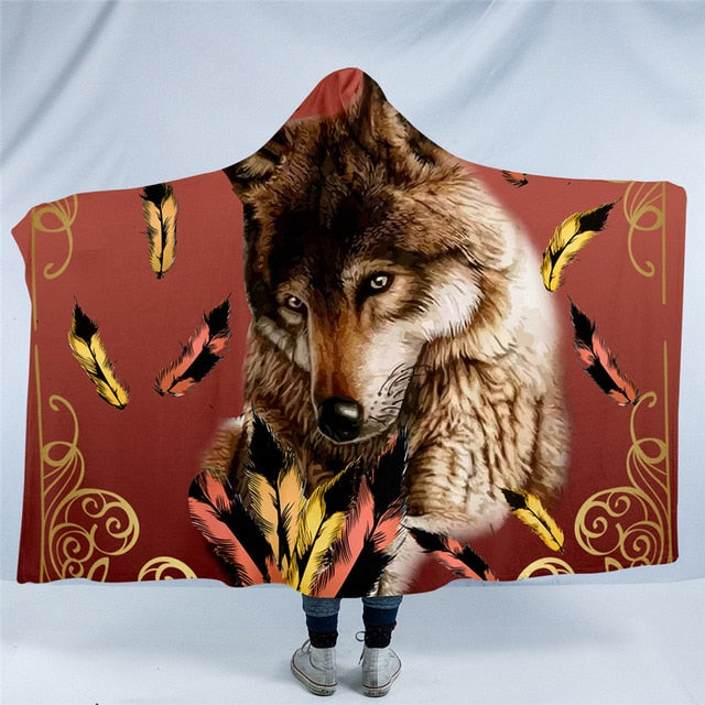 Hooded blanket with brown wolf portrait and yellow feather accents on rust print