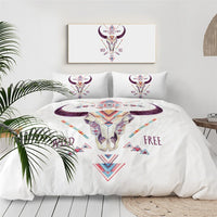 Native American bull skull bedding set with white duvet, purple tribal horn icon, and text