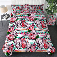 Multicolor bedding set with rose-and-bull motifs over striped aztec-style background
