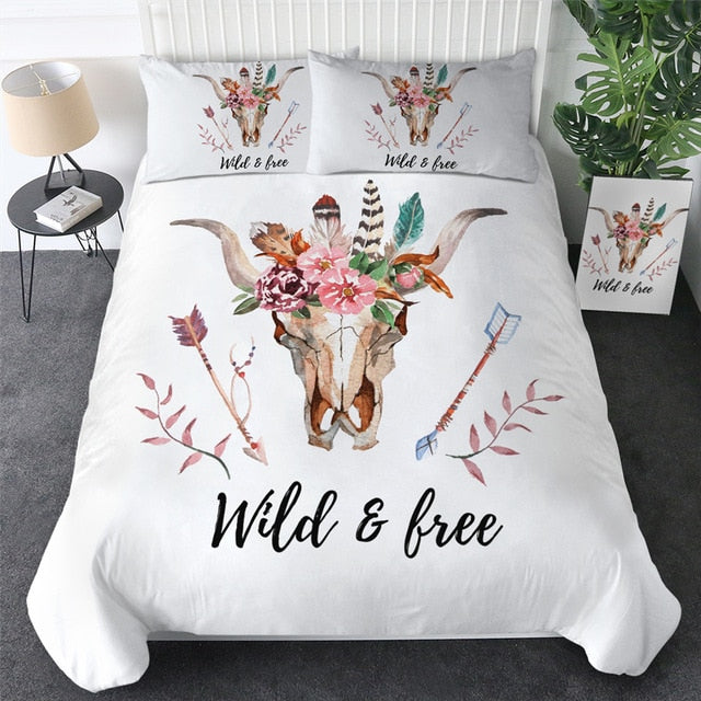 White bedding set with bull skull and floral graphics plus “Wild & free” text