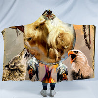 Hooded blanket with golden dog and wolf graphics plus a white eagle head