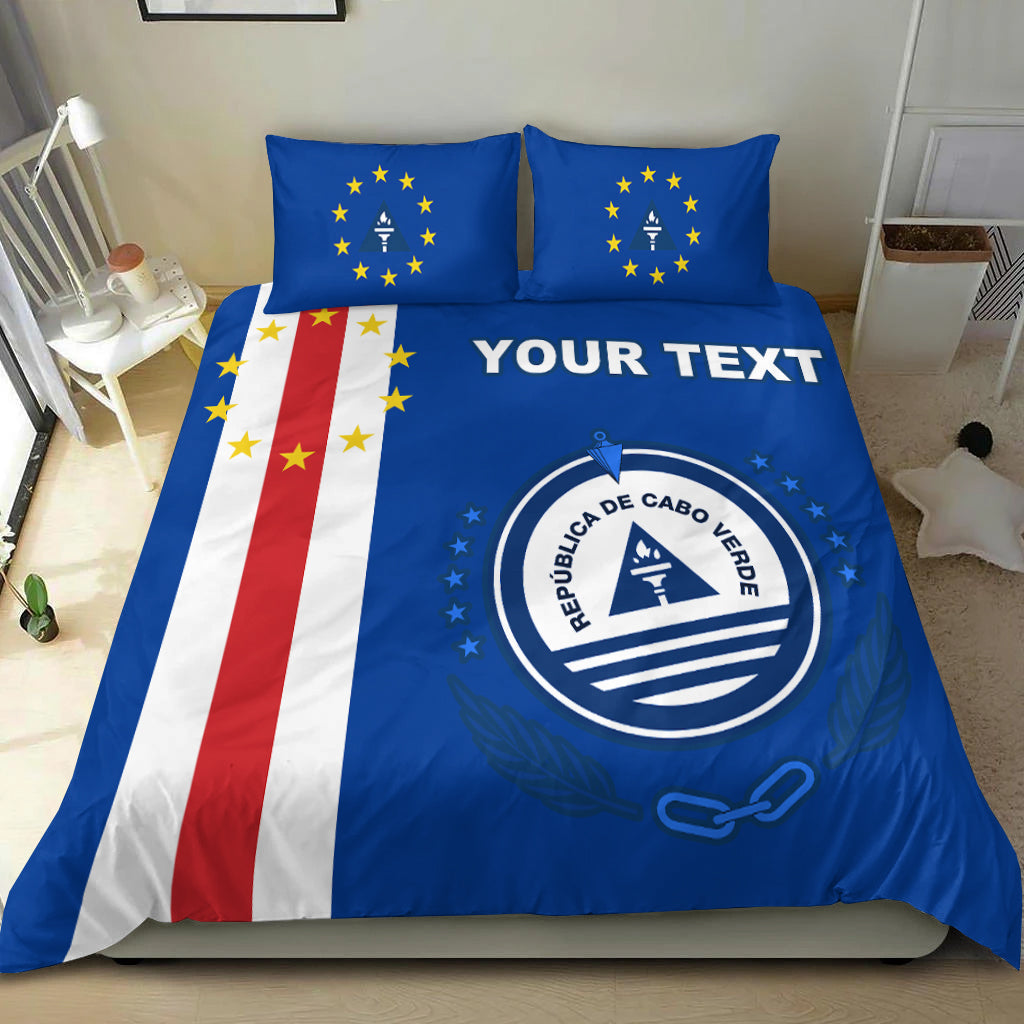 Blue Cabo Verde bedding set with custom text, emblem, and flag stripes on comforter