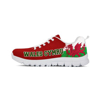 Red athletic sneakers with white laces, Wales Cymru print, and green dragon detail