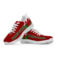Red lace-up sneakers, Wales Cymru lettering on sides, white sole, green dragon accents