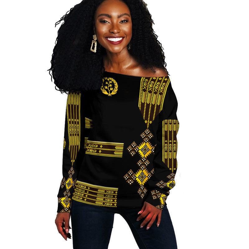 Women’s off-shoulder sweater, black with gold Eritrea-style geometric pattern, long sleeves