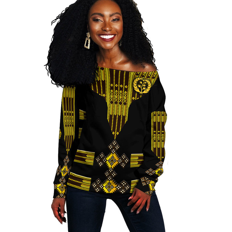 Black off-shoulder sweater with yellow Eritrean-style Tibeb pattern, long sleeves