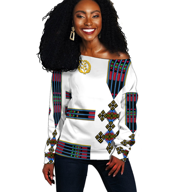 White off-shoulder sweater with colorful Eritrea flag-style pattern, long sleeves